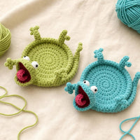 Posavasos de ganchillo lagartija en verde salvia y turquesa